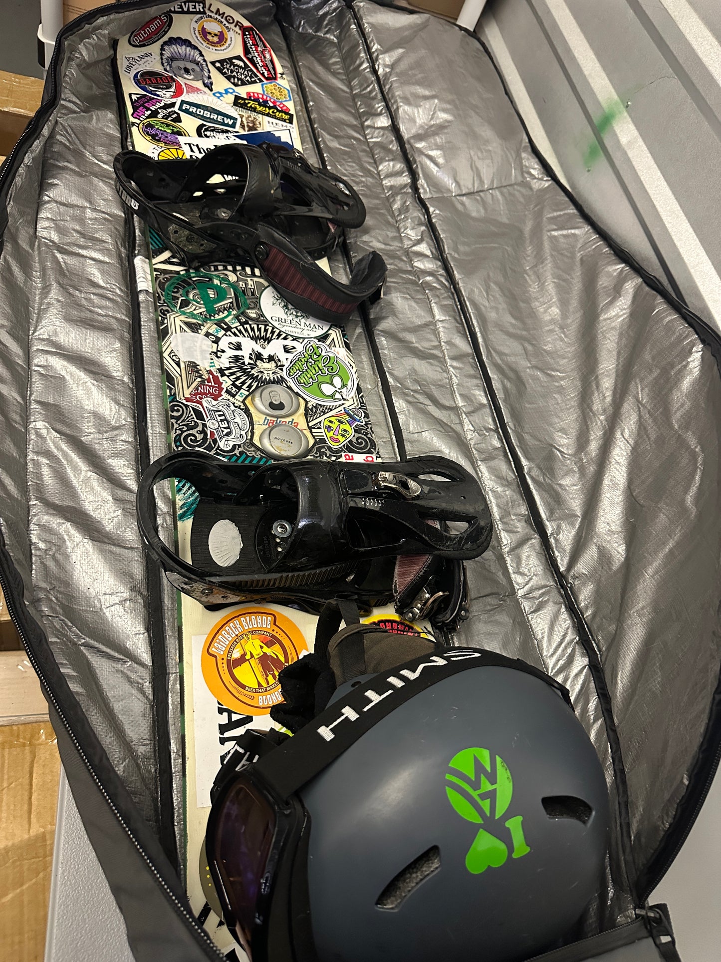 Snowboard with clothes and helmet and accessories