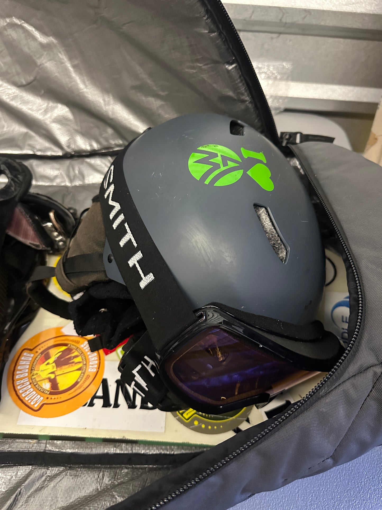 Snowboard with clothes and helmet and accessories